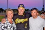 Deb Van Buren is pictured with her husband Scott and their host player, Nate Johnson.